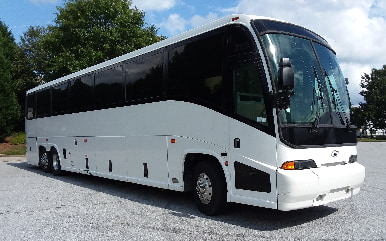 A white Go 365 Tours and Coach bus